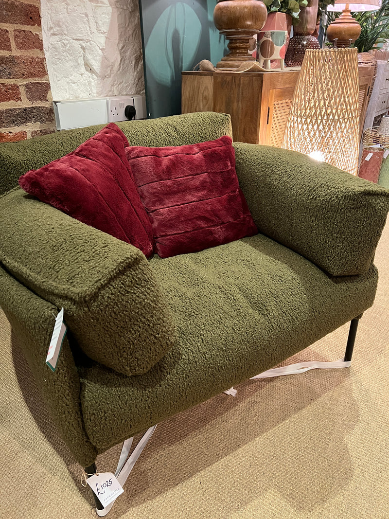 Forest green armchair in a soft boucle fabric