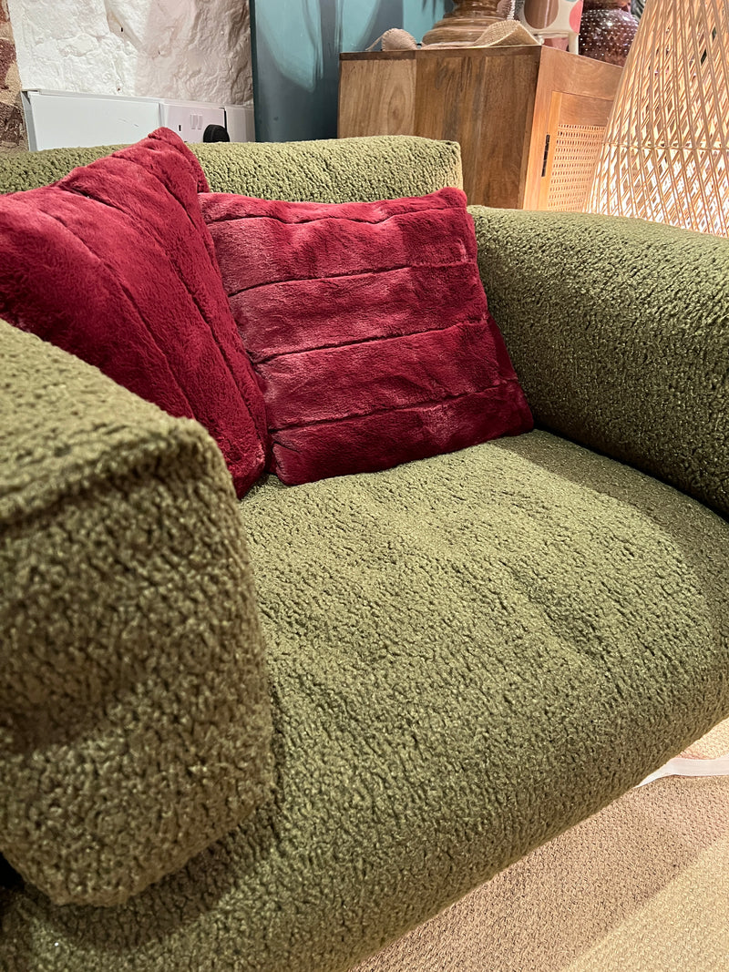 Forest green armchair in a soft boucle fabric