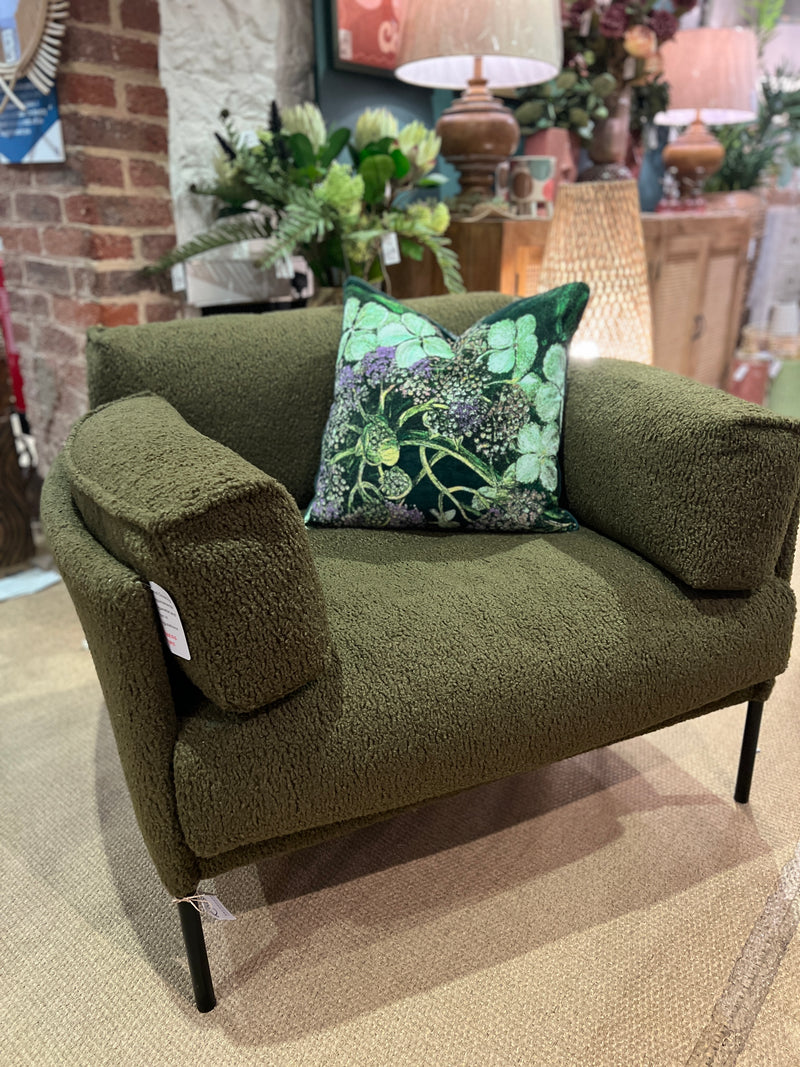 Forest green armchair in a soft boucle fabric