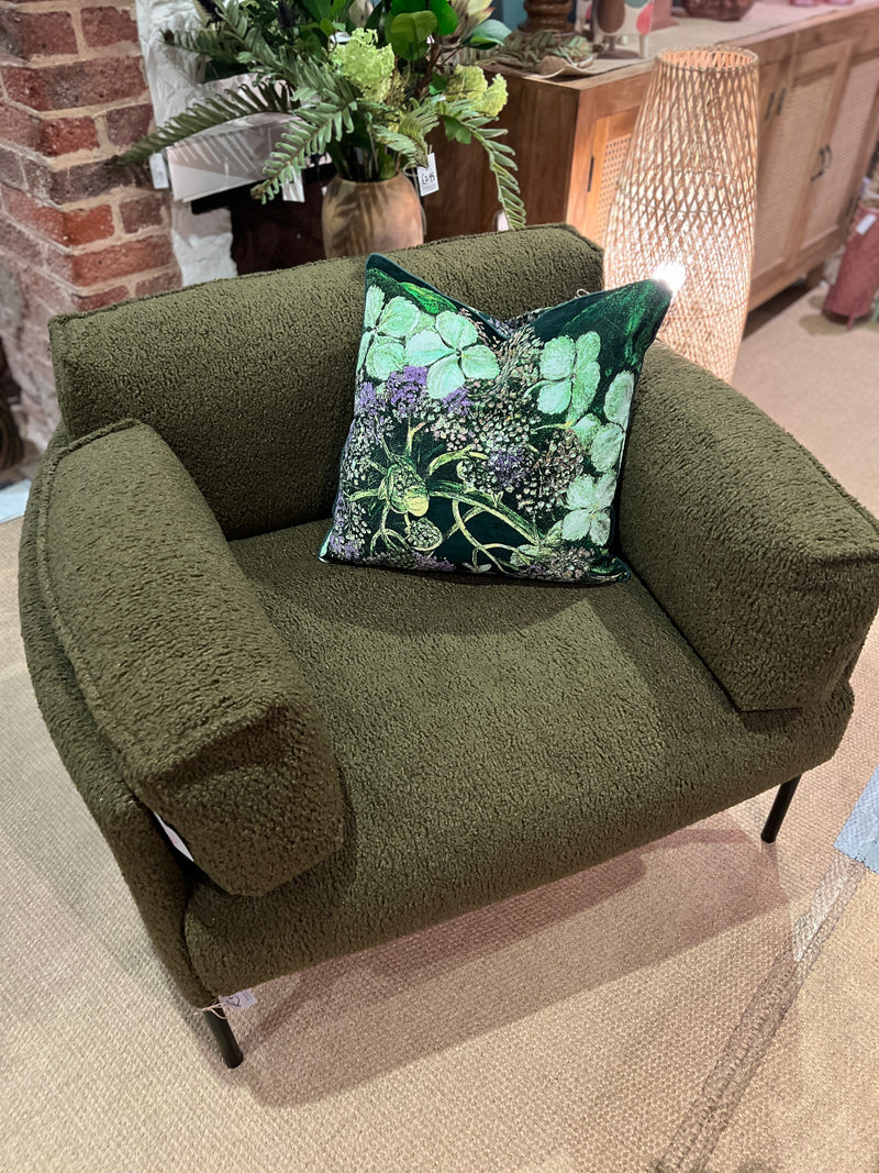 Forest green armchair in a soft boucle fabric