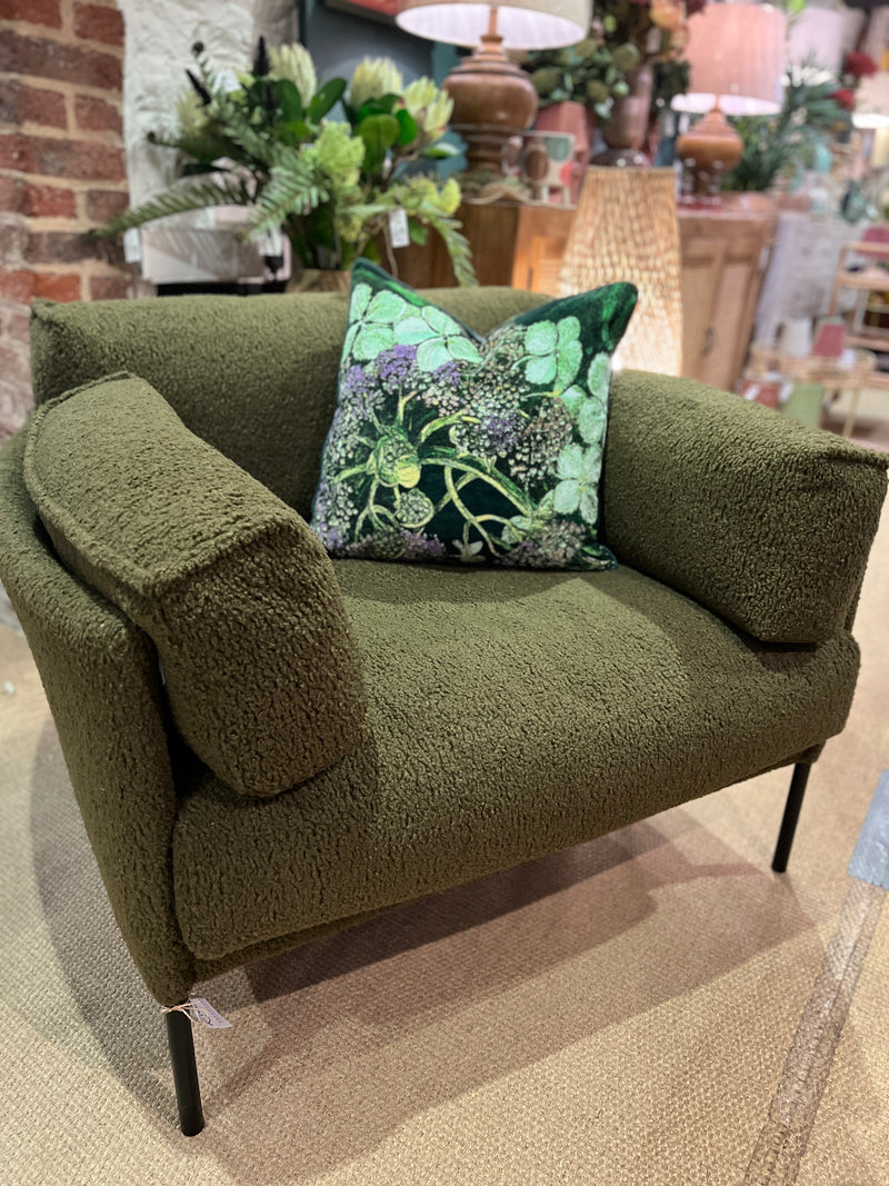 Forest green armchair in a soft boucle fabric