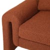 Burnt orange armchair in a soft boucle fabric